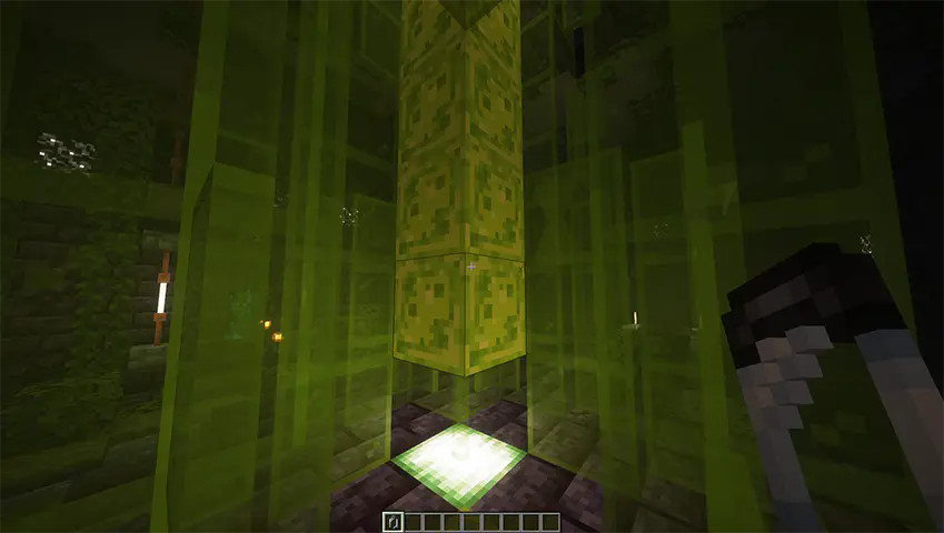 player holding an empty vial while looking at alien goo