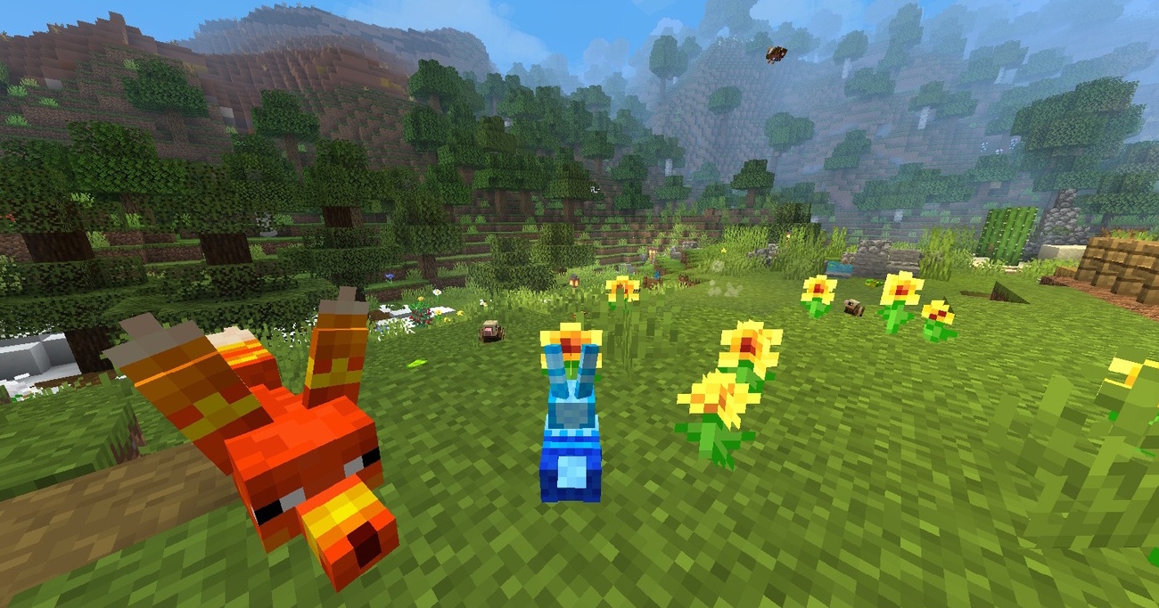 Various piñatas in a field of buttercups inside a garden