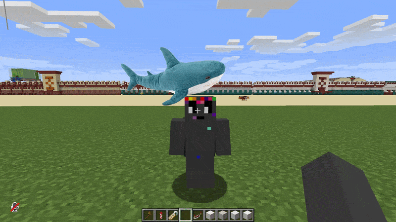 A player is getting an IKEA shark plushie slapped onto their head repeatedly.