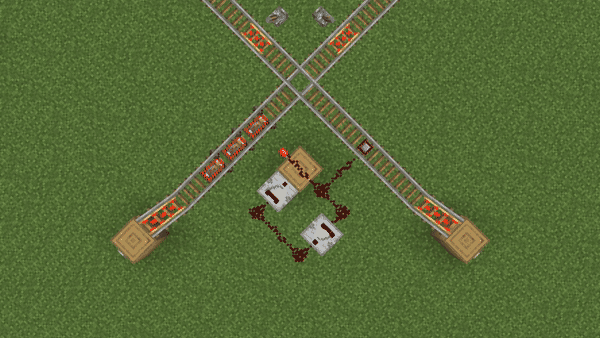 An Interruption Rail intersection with a priority. Minecarts from the left track are stopped using Interruption Rails and wait for ones on the right to pass.