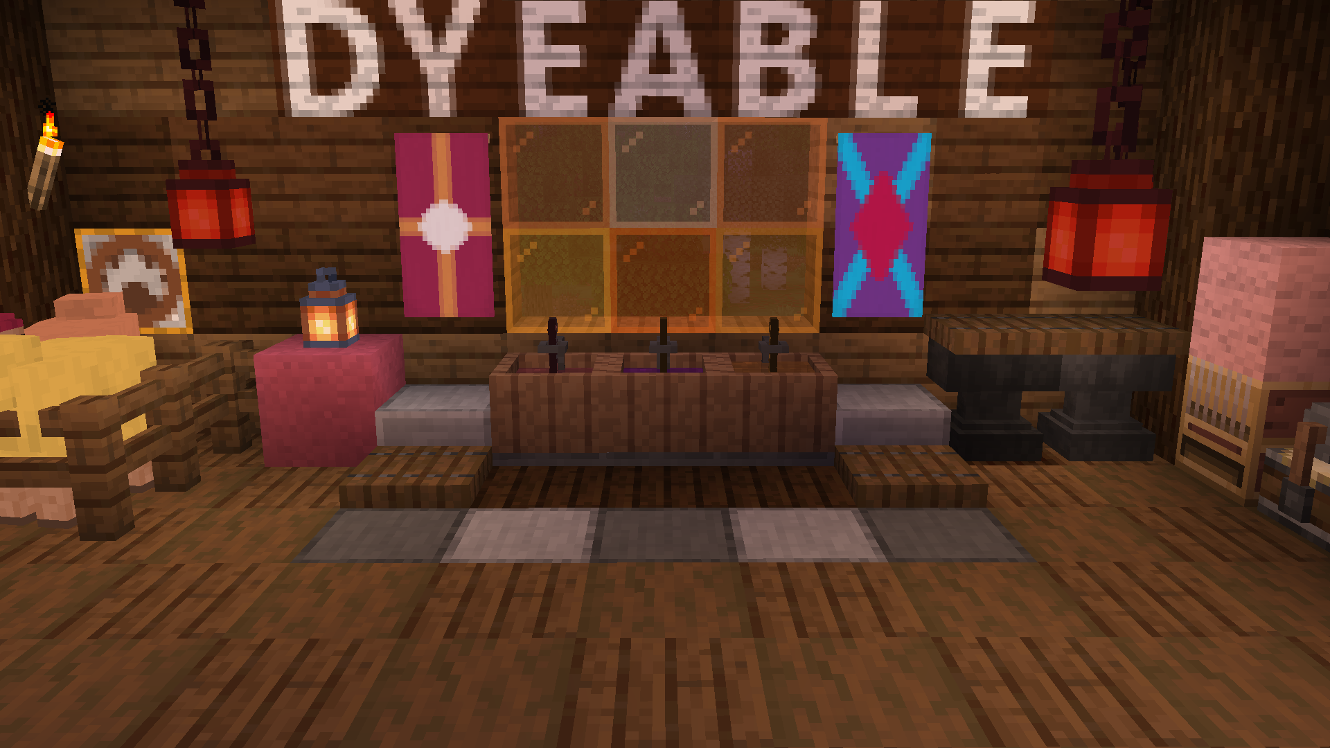 3 Dye vats sit in a room with spruce and dark oak walls and flooring. The vats are made of wood.  The vats have shovels in them, and the water in them is colored - from left to right - burgundy, purple, and orange. Above the vats are stained glass blocks with various shades of orange. 2 banners can be seen on the wall, one is rose colored with an orange cross and white dot. One is purple with a cyan diagonal cross with a fuchsia diamond in the middle. There are 2 sheep in a pen to the left, colored light yellow and rose. Lanterns hang from the ceiling, colored red. Big text on the wall above the glass read "DYEABLE" with each letter being a tile.