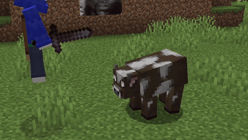 A cow taking two hits