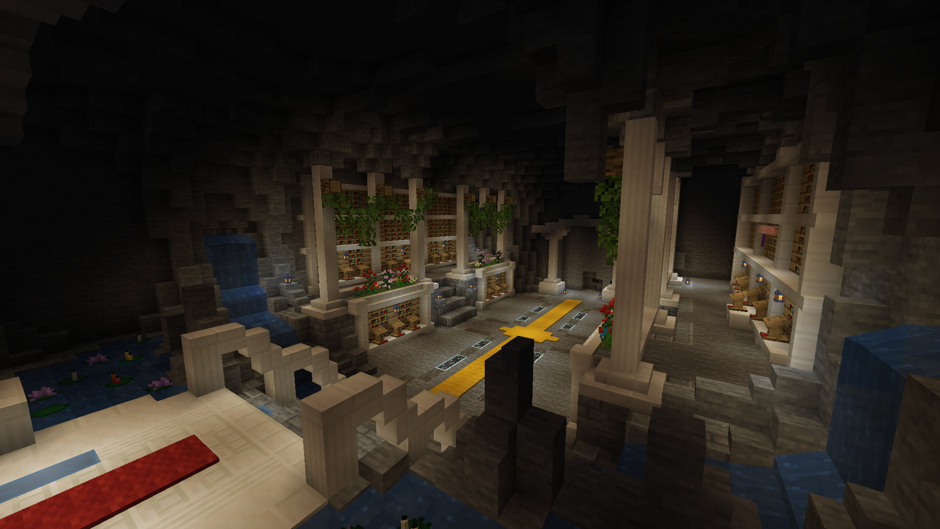 An overview shot of an underground library built with the modpack, showcasing various things previously not possible before like detailed arching, thinner pillars and more natural water flow and stone formations